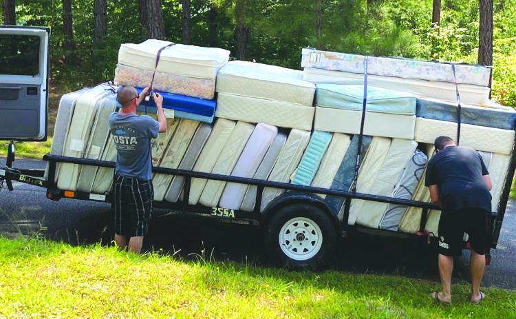 Submitted photo. The old mattresses are loaded up to be removed from campus. 
