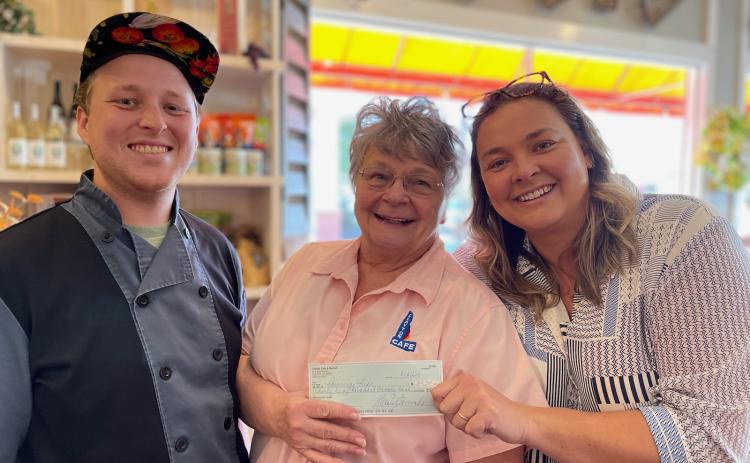Submitted photo. The Aug. 21 Spaghetti Dinner Raise a Fork for Great Causes fundraiser at Clayton Cafe & Market raised $4,550 for Rabun Paws 4 Life. Pictured are Chef Seth Curtis (left), Bonnie Edmonds, owner/operator of Clayton Cafe & Market, and Ara Joyce. 