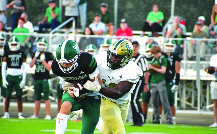 Wade Cheek/The Clayton Tribune. Coming from Baltimore, Md., defensive lineman James “Tank” Carrington made his Eagle debut as he registered two sacks of Christ School quarterback Mason Holtzclaw.