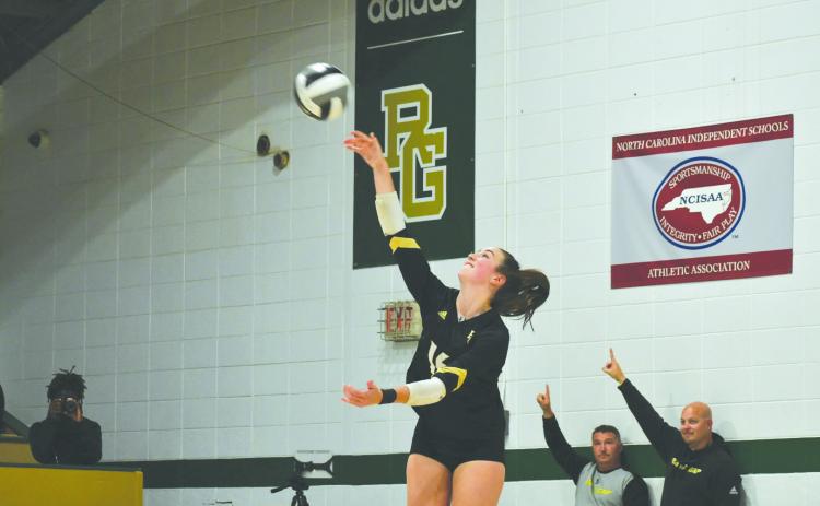 Wade Cheek/The Clayton Tribune. Eagle volleyball senior Sophia McNabb serves to Charlotte Latin School last Thursday in the second round of the NCISAA state playoffs. McNabb was named to this year’s CAA All-Conference list.  