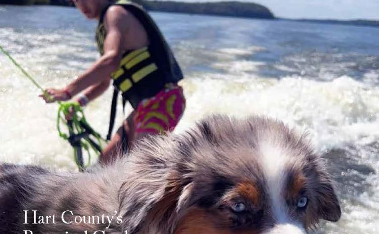 Photo by Brandi Brown. Brandi Brown of Elberton captured this photo of her son, Rylan Brown, wakesurfing with Dunk, a mini-Australian shepherd, on Memorial Day 2023 at Clarks Hill Lake. Brown’s photo was featured on the cover of the summer edition of Lake Living magazine.