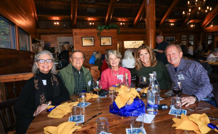 Photo courtesy Melissa Elzey. Mary Nichols, Paul and Judy Faletti, Lynne and David Homrich are all smiles at their table at The Burton Bash held at LaPrade’s Marina on Oct. 21. The fundraiser went toward the cause of clean and safe water.