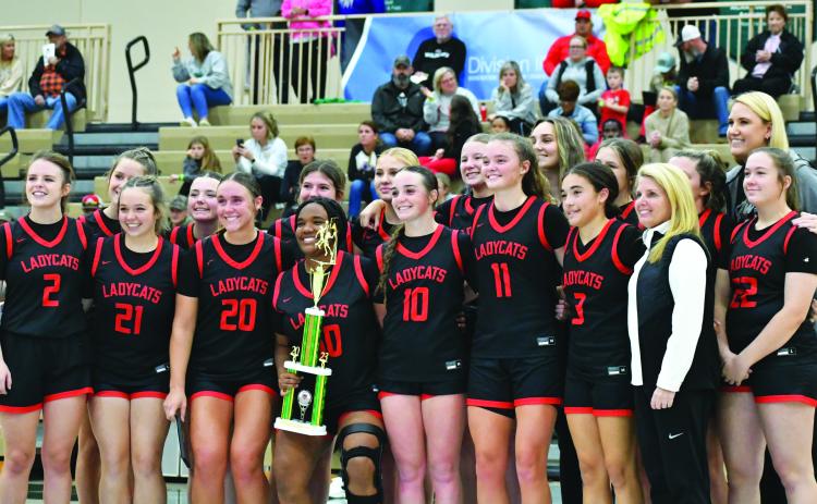 Wade Cheek/The Clayton Tribune. The Rabun County Lady Cats hoist the trophy from the Piedmont University Hardwood Classic after defeating Class AA Union County 82-80 as RCHS came back from being 19 points behind. The Lady Cats were led in the game by senior Lucy Hood who scored 41.