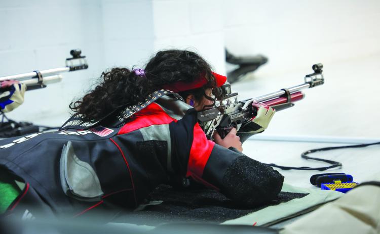 TFS Athletics. Brianna Walter prepares to shoot her rifle. Walter fared well in a qualifying event for Women’s Air Rifle Olympic Team.