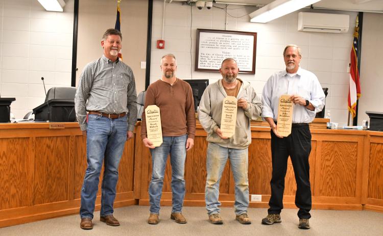 Megan Horn/The Clayton Tribune. Clayton Mayor Kurt Cannon recognizes outgoing council members Woody Blalock, David Cross and John Bradshaw for their years of service to the city. The three council members were presented with awards during Tuesday’s meeting and honored with a community reception. 