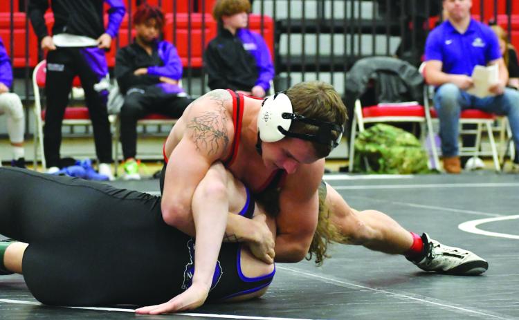 Wade Cheek/The Clayton Tribune. Rabun County’s Noah English pins his 165-pound opponent from Walhalla during the RCHS wrestling teams’ first home meet on Dec. 5. The Wildcats fell to Walhalla 48-32 but defeated 45-24.