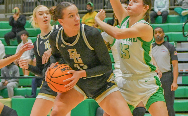 Wade Cheek/The Clayton Tribune. RGNS center Ola Noworol attempts a put-back layup over Buford’s Izzy Rettiger during the Lady Eagles’ Dec. 12 loss to the Wolves. RGNS rebounded in Tennessee after defeating Marshfield and Rockville high 
