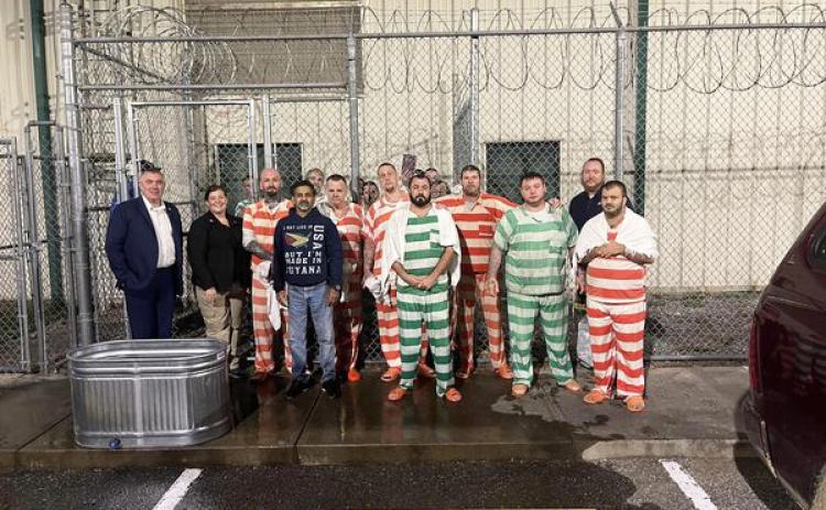 Submitted photo. Inmates at the Rabun County Detention Center recently requested and were baptized in a metal trough on the property.