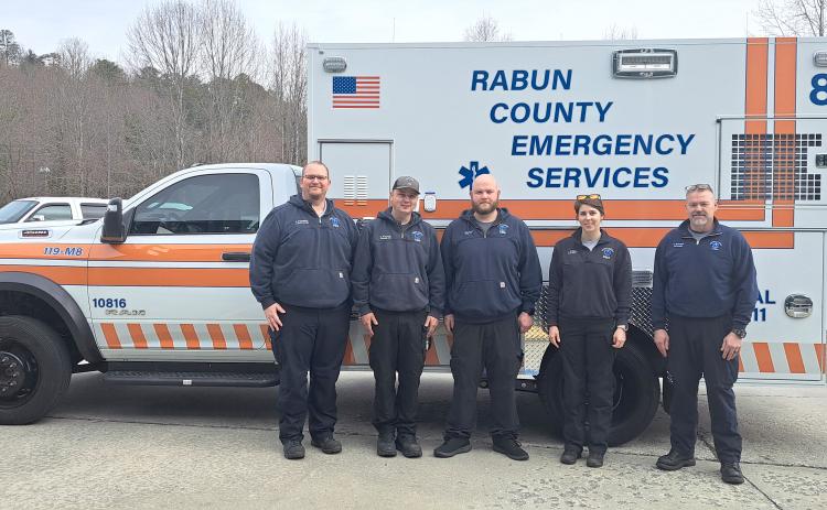Megan Horn/The Clayton Tribune. Pictured with the new EMS ambulance are Lt. Jared Coleman, Paramedic Tate Nichols, EMT Logan Carnes, EMT Annie Lewis, and Paramedic Kelly McDonald. 