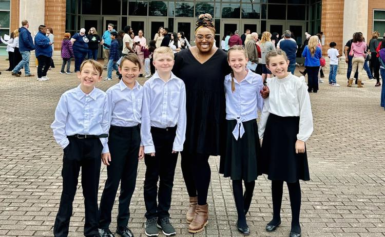 Submitted photo. Rabun Gap-Nacoochee School fourth and fifth-grade choral students recently participated in the highly selective GMEA Honors Chorus. Pictured (from left) are Harrison Green ’31 of Rabun Gap; Hudson Garner ’31 of Franklin, N.C.; Conor Healy ’32 of Clarkesville; Lower School music teacher Ms. Quashona Antoine; Crosby Kennett ‘31 of Rabun Gap; and Natalie Wood ‘31of Highlands, N.C. 