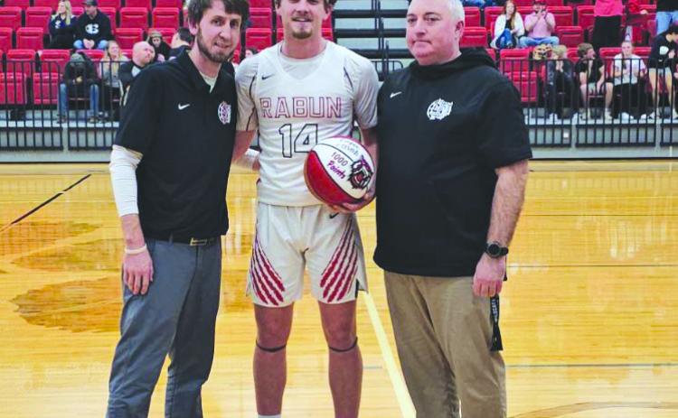 Submitted. Rabun County hoops standout forward Cooper Welch (middle) stands with his father Jonathan Welch (right) and RCHS head coach David Adcock after scoring the 1,000th-point of his high school career. 
