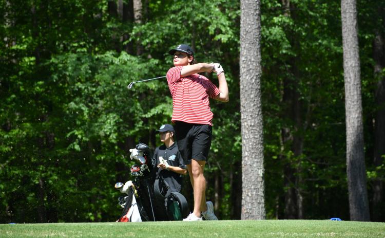 Wade Cheek/The Clayton Tribune. RCHS senior golfer Blake Weber tee's off during the Area I tournament last Monday, April 22 at Arrowhead Pointe Gold Course in Elbert County. 