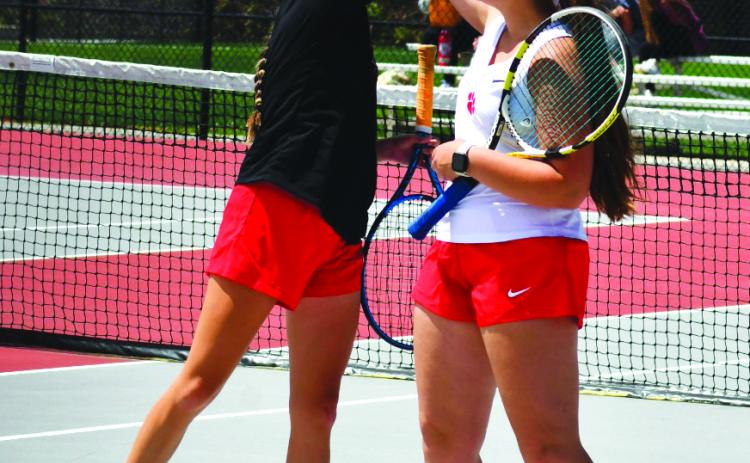 Enoch Autry/The Clayton Tribune. Junior Lucy Maney and sophomore Caroline Marshall celebrate a well-earned point during the RCHS girls tennis team’s 3-0 playoff win over The Weber School on Monday, April 22.